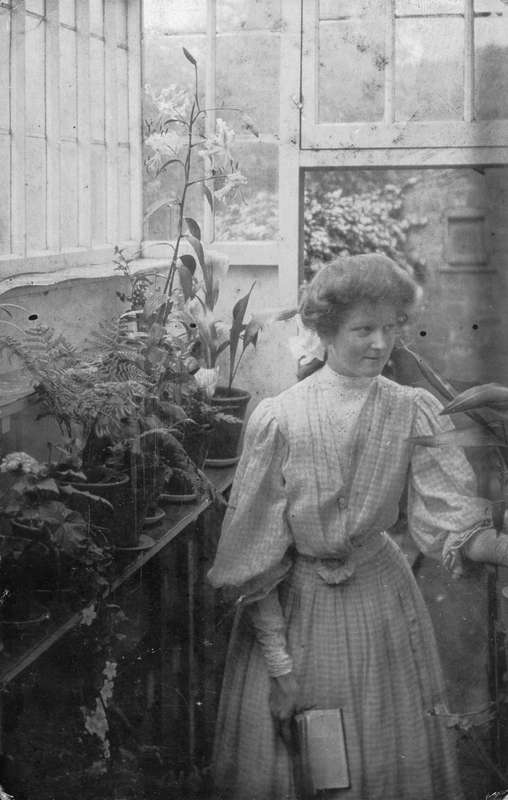 Ethel Bryant (later Wilson) in a greenhouse
